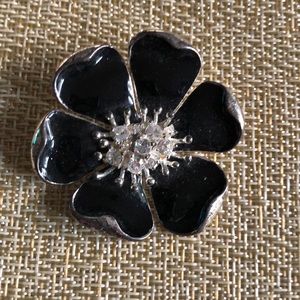 Black enamel and rhinestone flower brooch